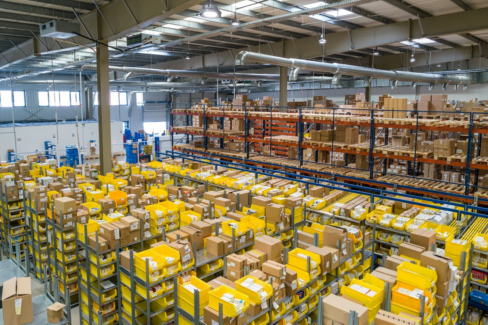 A logistics professional scanning inventory in a bright warehouse